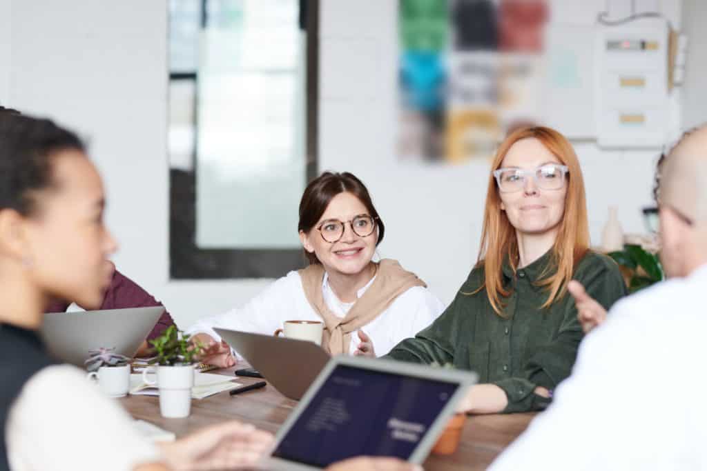 Group of people working on laptops