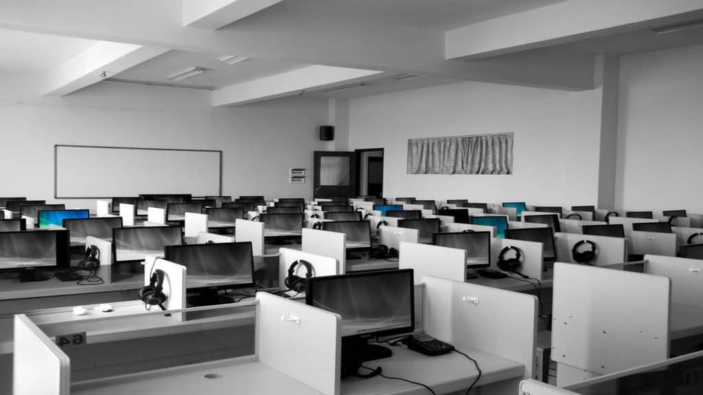 Large empty office with unused PCs and desks