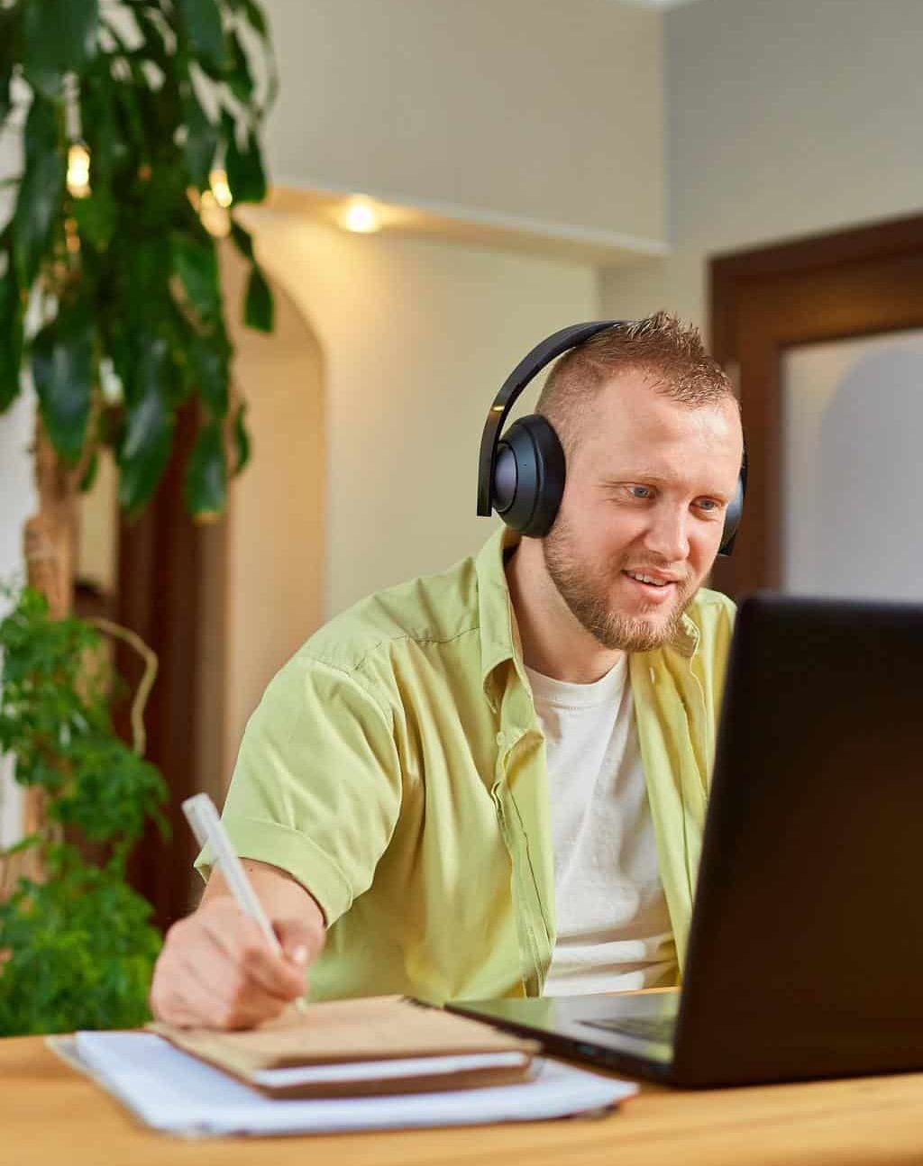 Happy Man wearing wireless headphones watch webinar, trainning, course