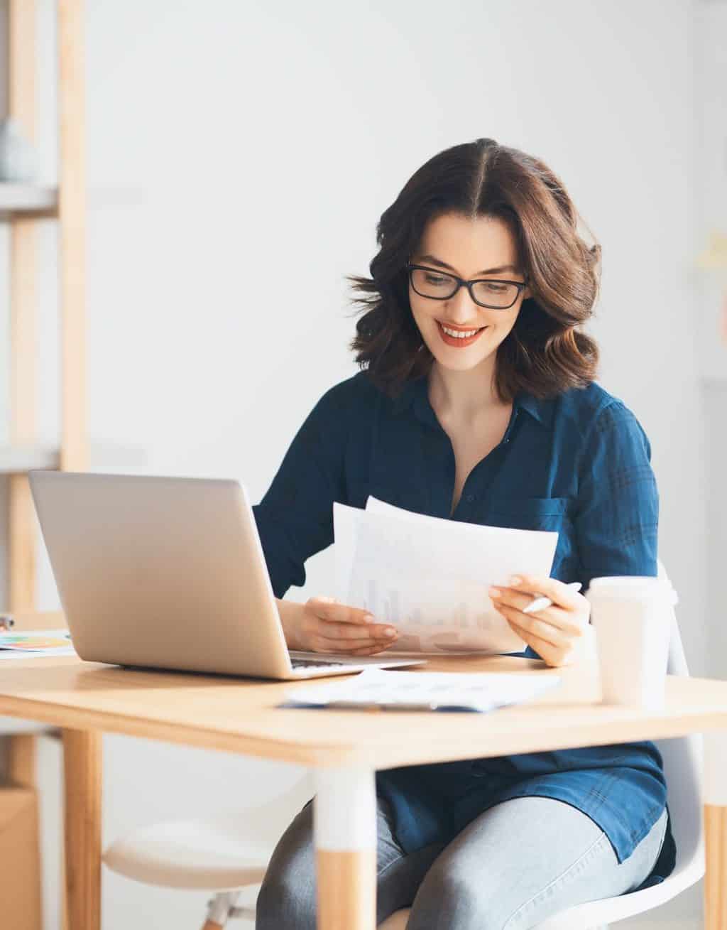 Woman working on a laptop.