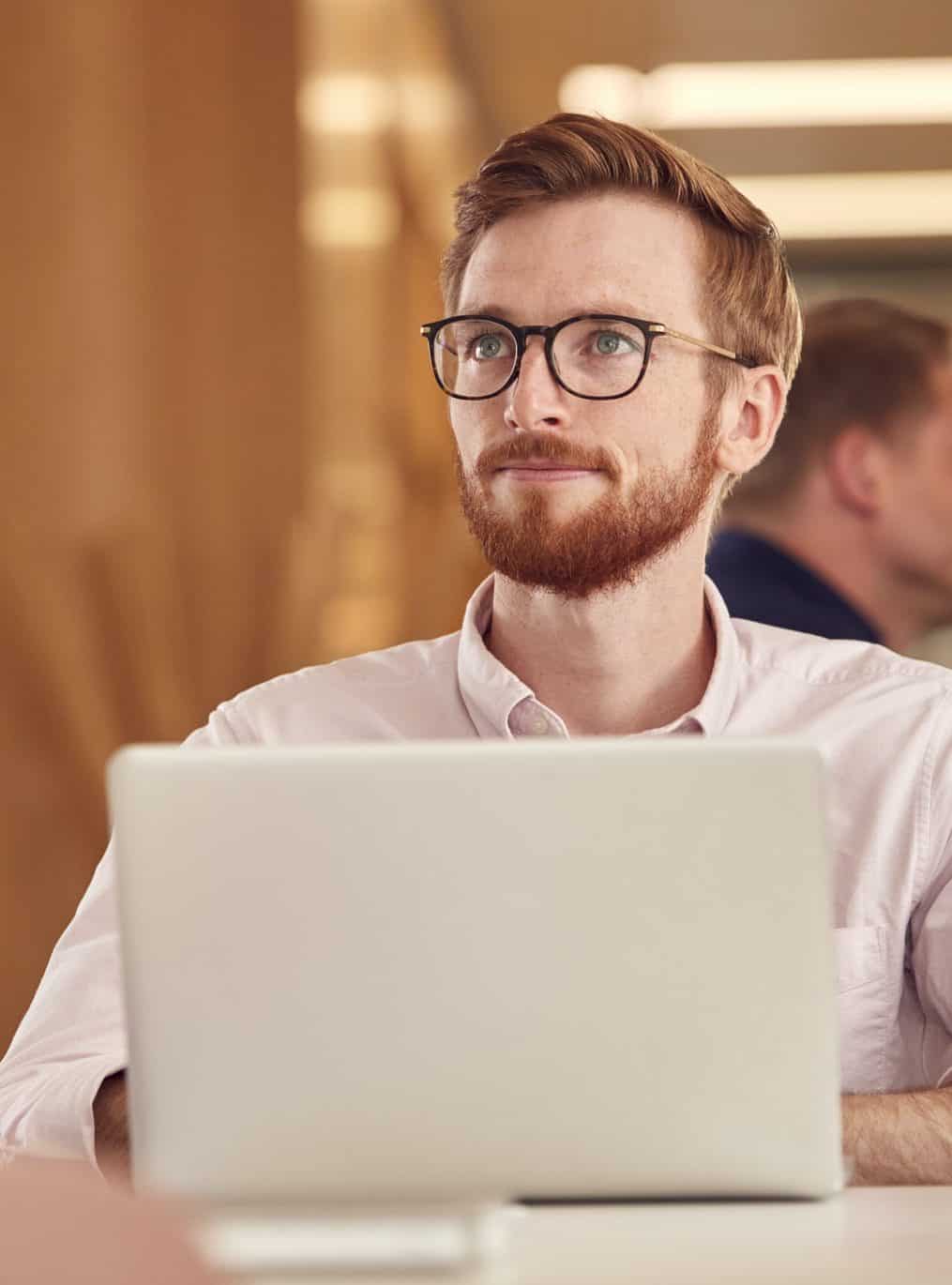 Businessman With Laptop Working On Table In Office Coffee Shop