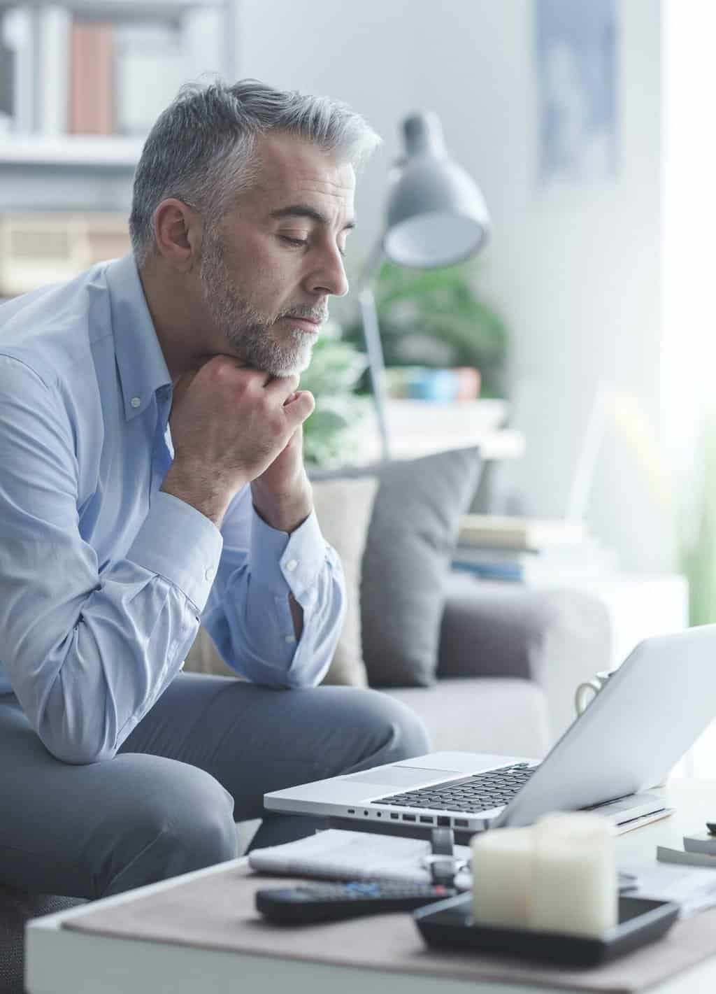 Businessman working at home with Symantec technologies