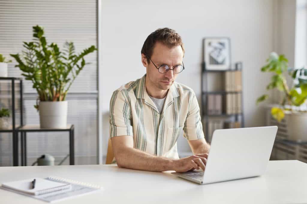 Man Working On Laptop