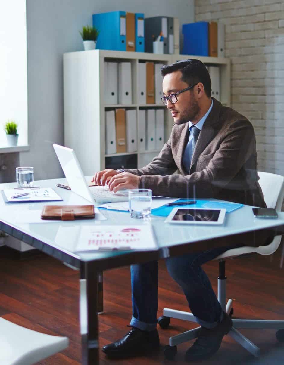 Man working in modern office on laptop