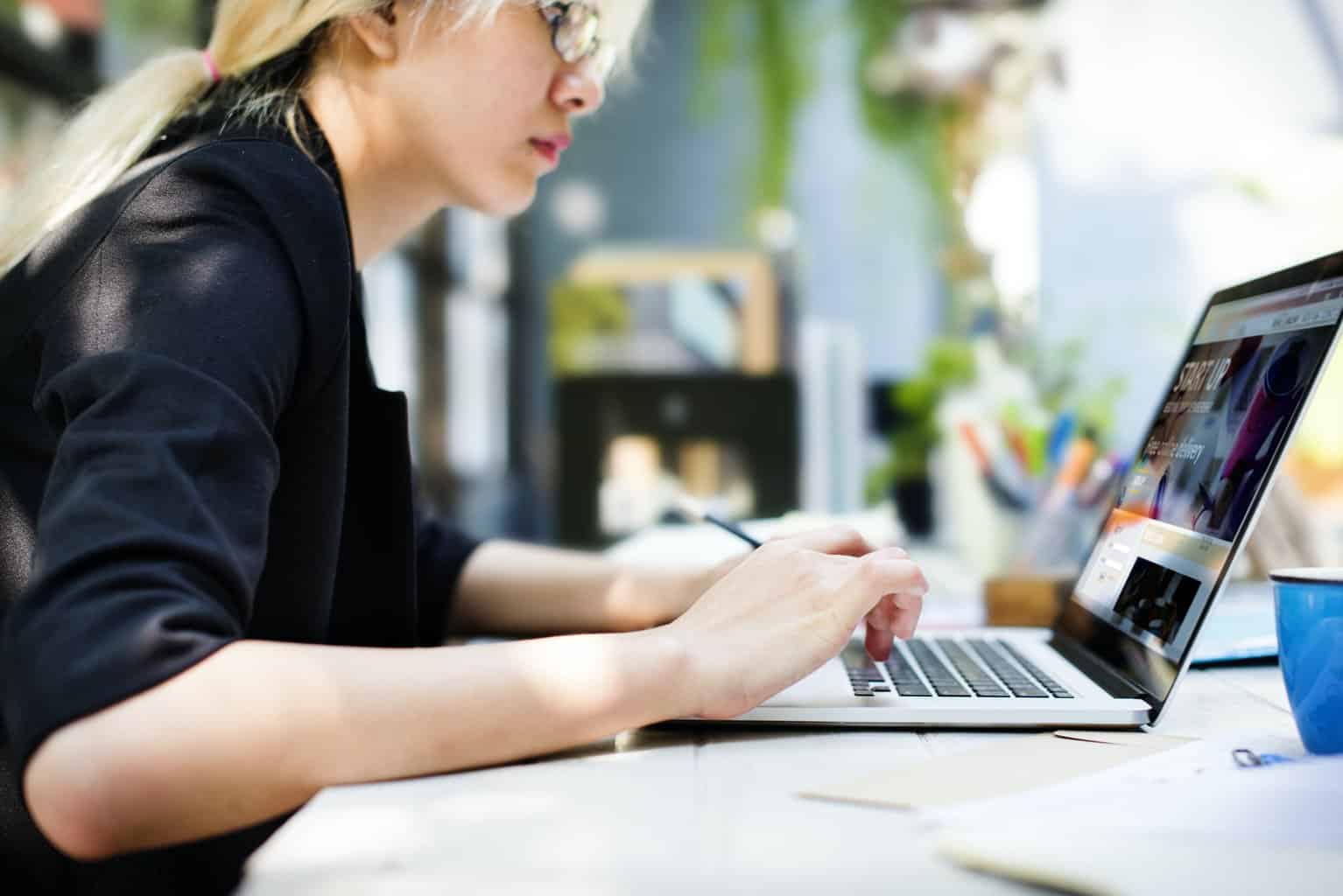 Businesswoman remote working on laptop