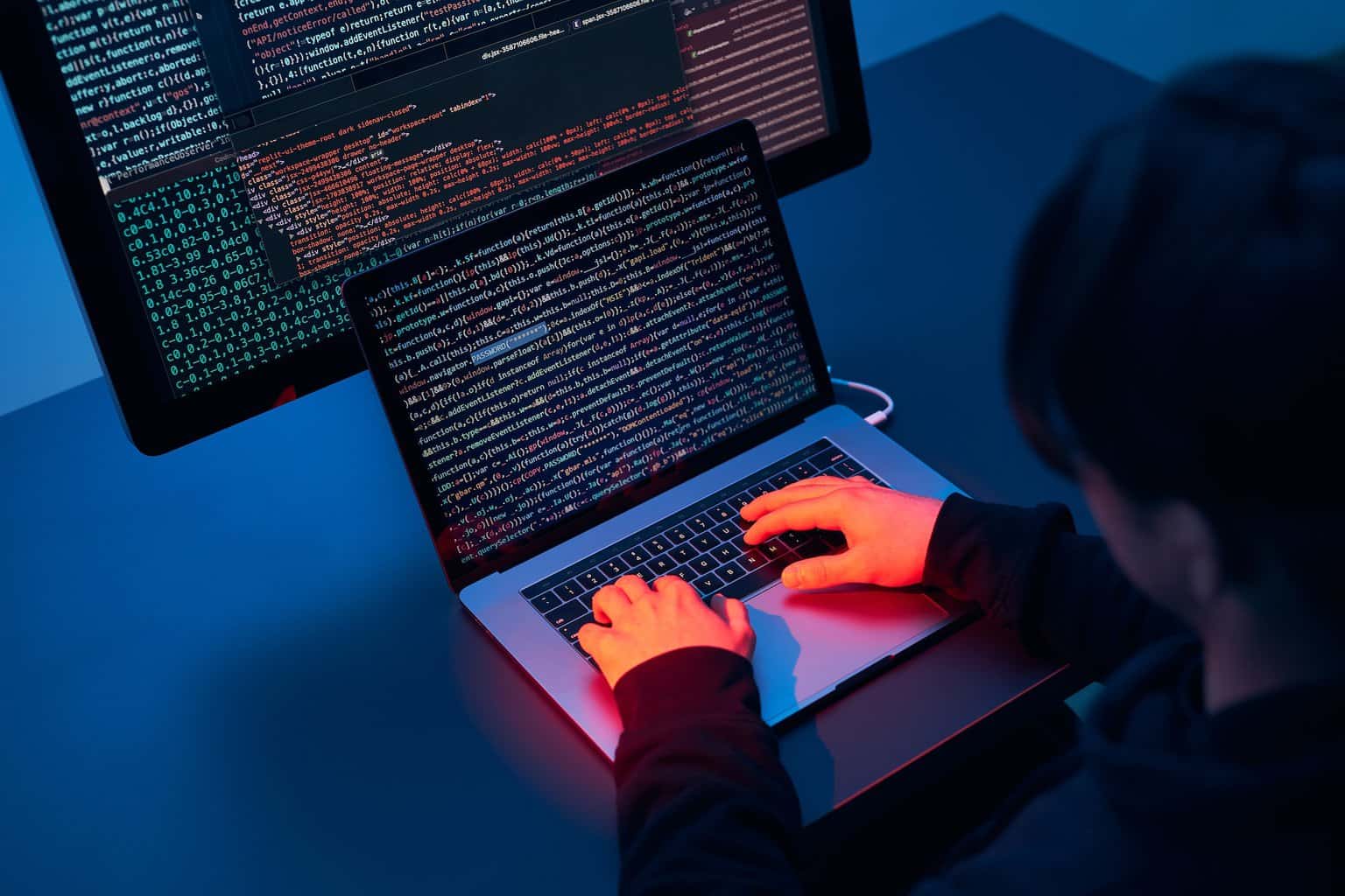 Man using computer and programming to break code. Cyber security threat. Cyber attack