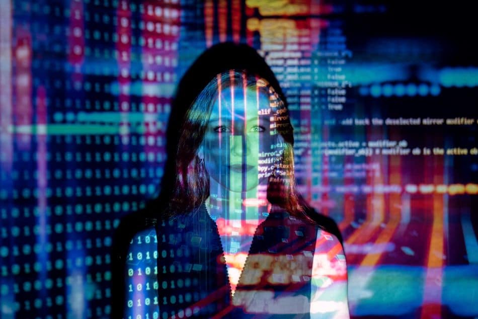 Red Haired Woman with Data Reflected on Face